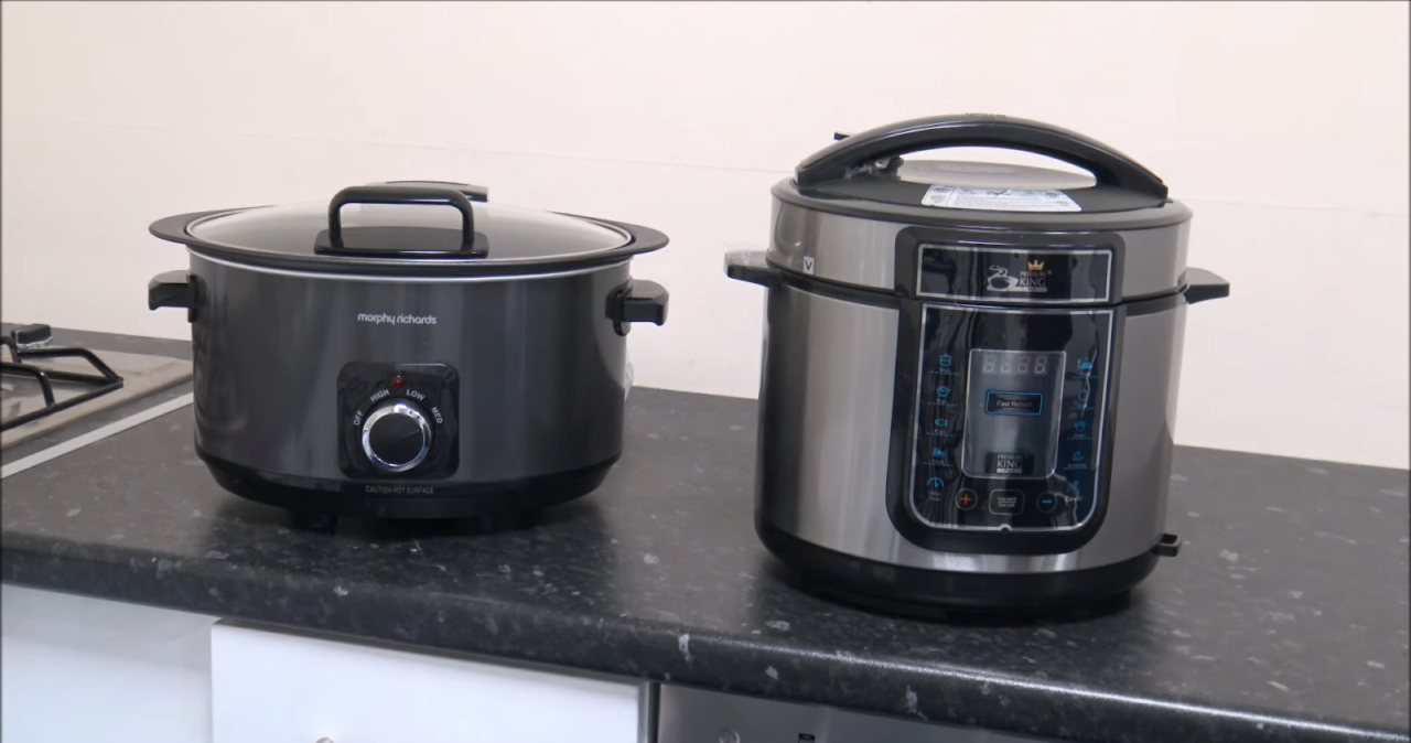 two black crockpots on the black table