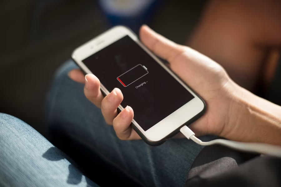 Hand holding a charging phone